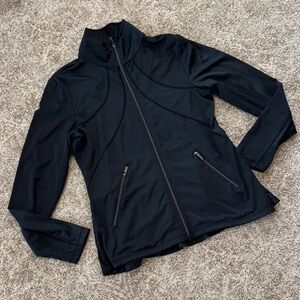 Tail black zip golf jacket with back ruffles.